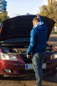 man in trouble with his broken car